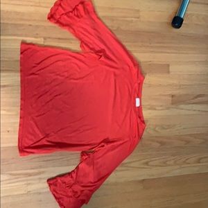 t.la red top. 3/4 length sleeves and size small